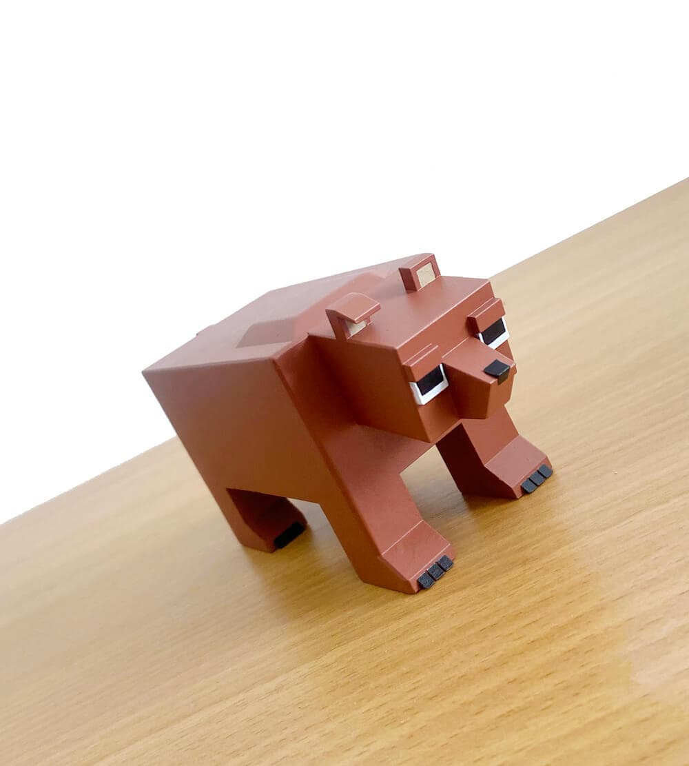 An Anible bear figurine on a desk